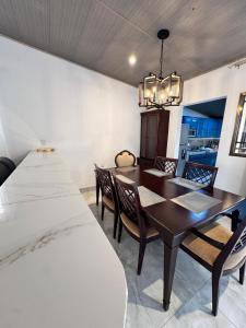 a dining room with a table and chairs at Casa Dulce in Estelí +9 photos