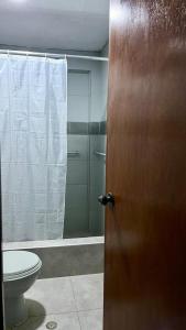 a bathroom with a toilet and a shower at Morada del Huascarán in Mancos +2 photos