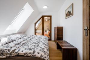 a bedroom with a bed and a mirror at Jarkova panorama view in Prešov