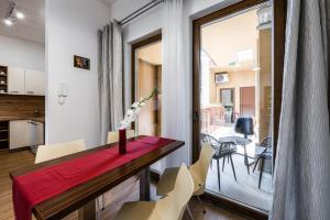 a kitchen and dining room with a table and chairs at Jarkova panorama view in Prešov