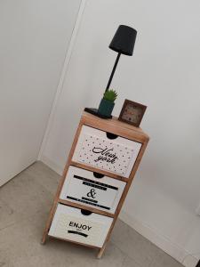 a book shelf with a lamp on top of it at 33 Joy Dreams in Sandra