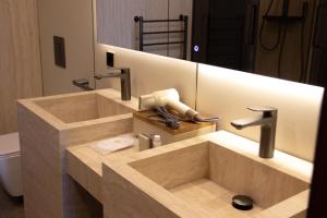 a bathroom with a sink and a mirror at Boutique Hotel 19D in Almaty