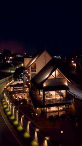 a building with lights in front of it at night at Royal Lake Hotel in Nuwara Eliya +22 photos