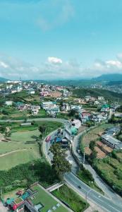 an aerial view of a city with a road at Royal Lake Hotel in Nuwara Eliya