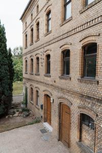 a large brick building with two sets of doors at "LOKAL" Apartment 2 in Bad Muskau