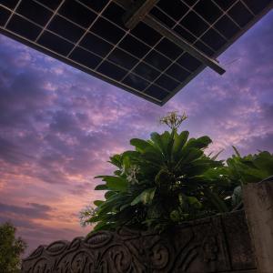 a view of the sky with a solar panel at Homestead thapli in Pinjaur