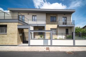 a building with balconies on the side of it at Civico 91 Guest House in Silì