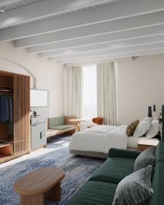 a bedroom with a bed and a living room at Harbour Rocks by Ode Hotels in Sydney