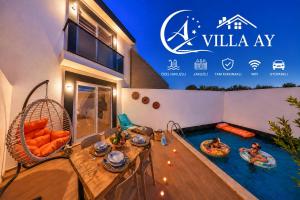 a villa with two people in a swimming pool at Villa Ay in Kaş +18 photos