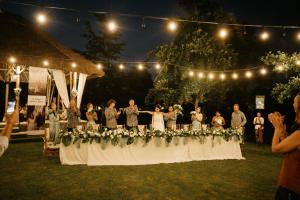 a group of people standing on a table with flowers at Visesa Ubud Villa and Resort in Ubud +145 photos