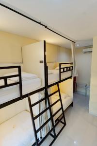 a group of bunk beds in a room at V Canggu Dormitory in Canggu +20 photos