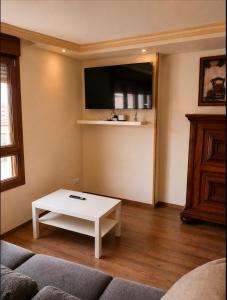 a living room with a couch and a coffee table at Conde de Lerín by Clabao in Lerín