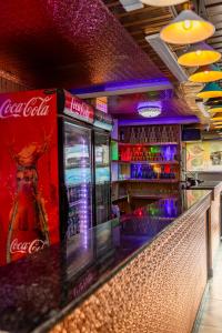a bar with cocacola soda machines and drinks at View point Restaurant and homestay in Kathmandu