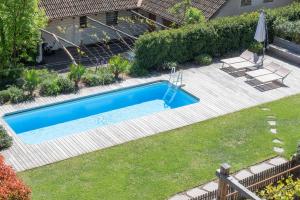 an image of a swimming pool in a yard at Villa Montis Exclusive Holiday Apartments in Eppan with Spectacular Views of Dolomites and Bolzano Area in Appiano sulla Strada del Vino