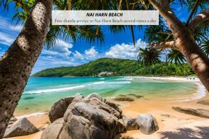 a beach in the dominican republic with a sign that reads new man beach at La Vita Bao in Phuket