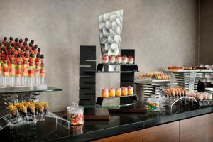 a buffet line with many different types of desserts at The First Collection Dubai Marina in Dubai