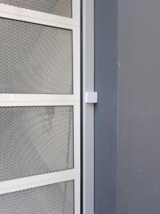 a close up of a door with a window at Elite Suite in Liège