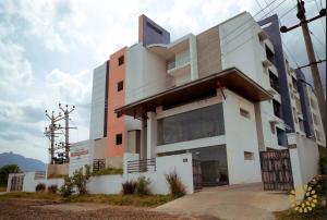 a building with a lot of windows at SR BOUTIQUEE STAY in Coimbatore