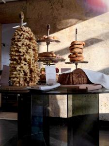 a display of pastries and bread on a table at Hotel Logos in Warsaw