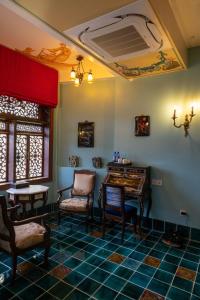 a room with a table and two chairs and a table and a table sidx sidx at Thien Y Villas in Hue