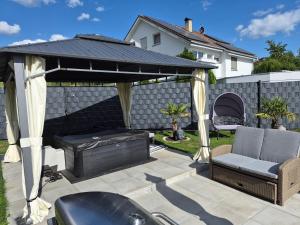a gazebo with a couch and a chair under it at Ferienwohnung Witt in Salem