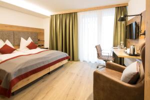 Una cama o camas en una habitación de Sonne 1806 - Hotel am Campus Dornbirn