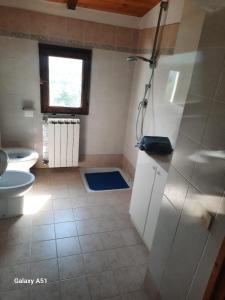 a bathroom with a shower and a toilet at casa delle arti in Salutio +15 photos