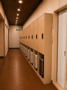 a room with a row of soap dispensers on the wall at LUX Niseko lodge in Niseko