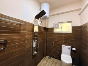 a bathroom with a toilet and a camera on the wall at Crown Valley Boutique Lifestyle Hotel, Ella in Ella +161 photos