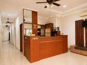 a lobby with a reception desk in a building at Wisma Pelangi 5 in Jakarta