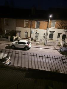 a car parked on a street at night at Upton House in Chatham