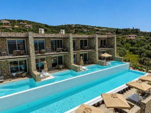an image of a villa with a swimming pool at Gialova Sunset Apartment in Gialova