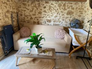 a living room with a couch and a table at Lovely Country House in Trappeto