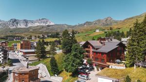 an aerial view of a small town in the mountains at Hotel Sonnenhalde, Arosa in Arosa