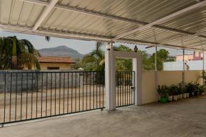 a patio with a gate and a fence at Ananda Villa in Igatpuri