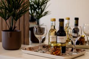 a table with two wine bottles and wine glasses at Ligiades 945 in Ligiades