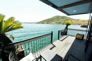 a balcony with a view of the water at Dream house in Rragam +12 photos