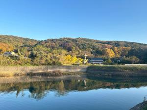 a view of a river with a mountain in the background at Kibe House in Kunisaki