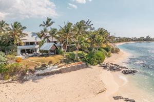 an aerial view of a house on the beach at Villa Karma by muse villas in Grand-Baie