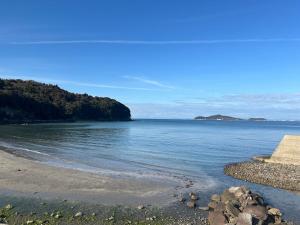 a view of the ocean from a beach at Kibe House in Kunisaki