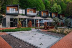 a building with a courtyard with a fountain in front of it at Melekona House in Kartepe