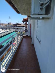 a balcony of a house with a swimming pool at Catalina studios 2 in Olympic Beach