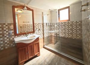 a bathroom with a sink and a shower at John & Mary's House near Elafonisi Beach in Perivólia