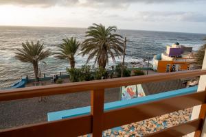 a view of the ocean from the balcony of a resort at Música do Mar in Ponta do Sol