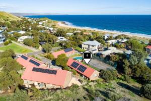 an aerial view of a house with a sign at NR 4 Cove Apartment Carrickalinga in Carrickalinga