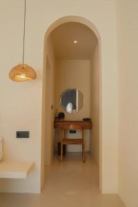 a hallway with a table and a mirror at Montelago Batur in Bangli +17 photos