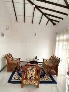 a room with a table and two chairs and a table at Ciao Villa, Kandy in Kandy