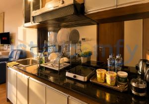 a kitchen with a sink and a counter top at Studio Aston Residence 0306 City View in Nagoya
