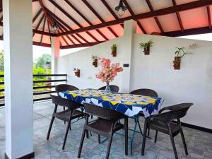 a dining room with a table and chairs at Dishan Green Retreat in Ambalangoda