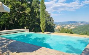 a swimming pool in a villa with a view at Podere Lama in Castelnuovo di Val di Cecina